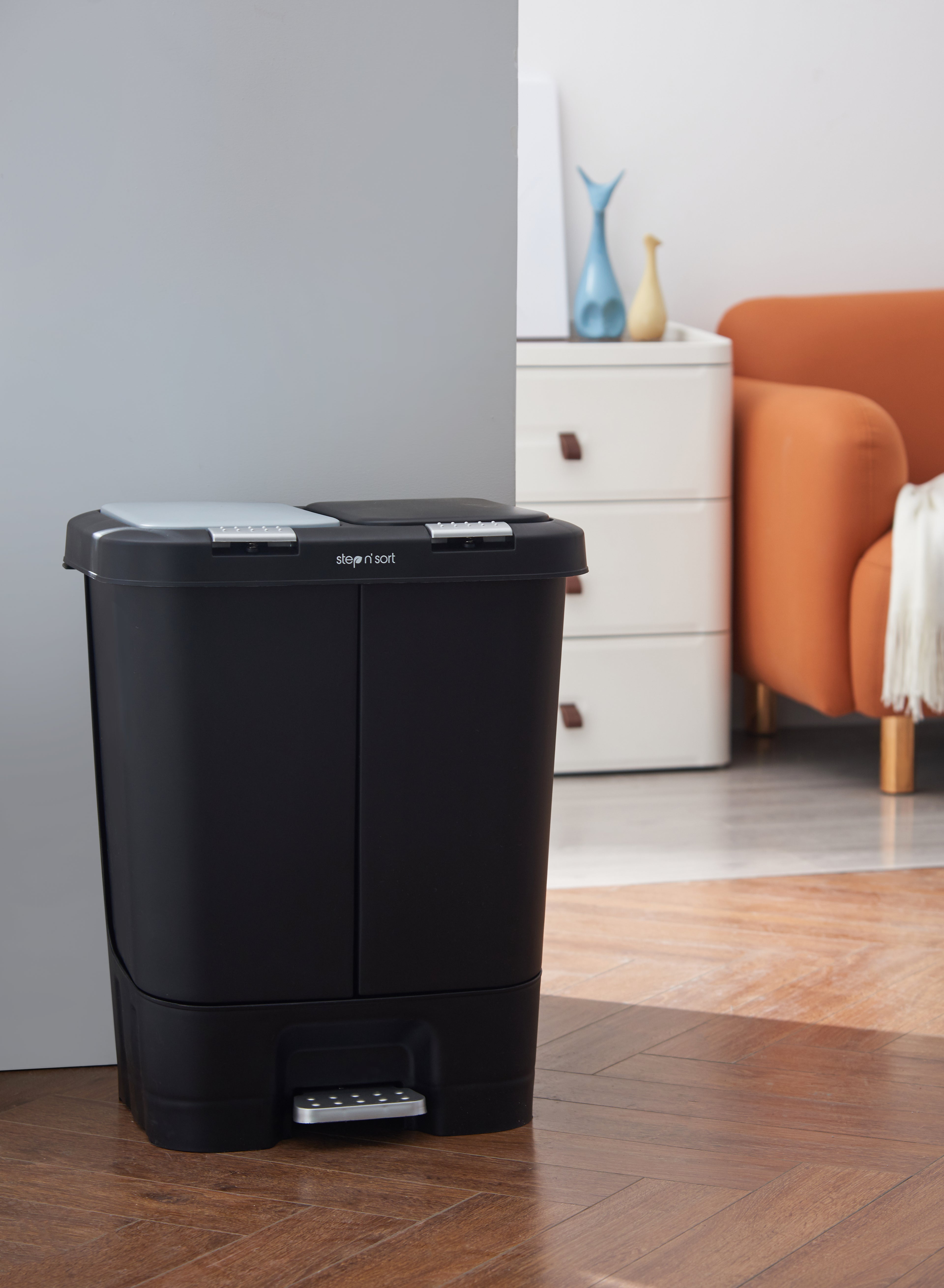 Step N Sort 40L dual recycling bin black kitchen bin placed in modern home interior next to cabinet